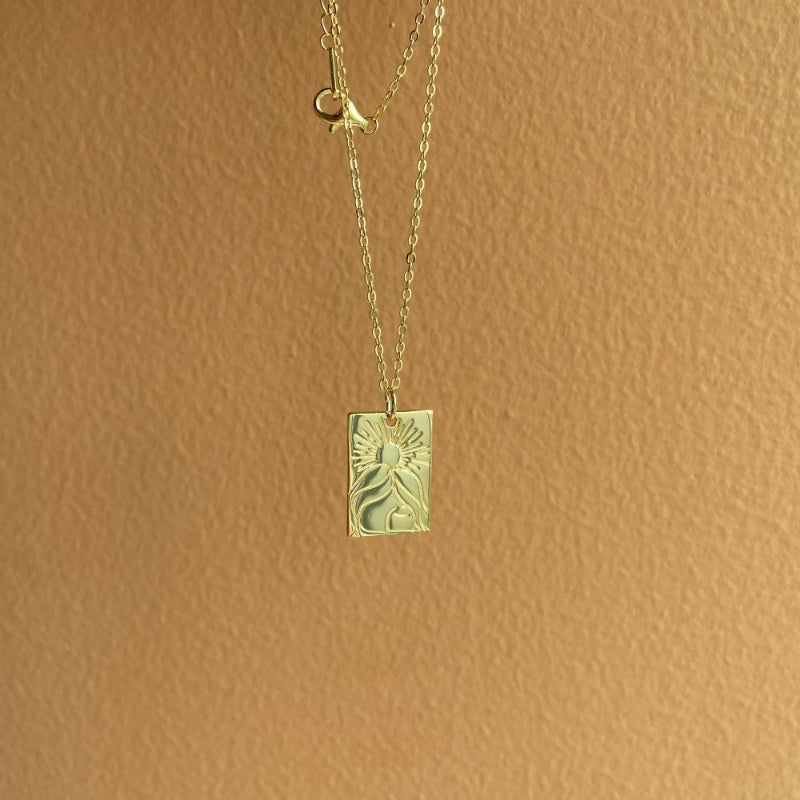 Engraved Sun and Human Profile Charm


