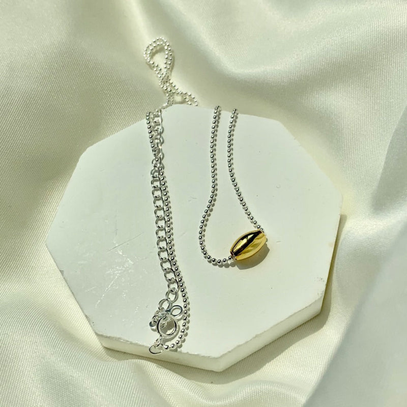 Sleek Gold-Toned Bead on Silver Chain

