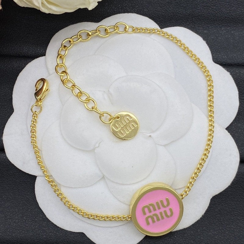 Miu Miu Gold-Plated Jewelry Set with Logo Tag

