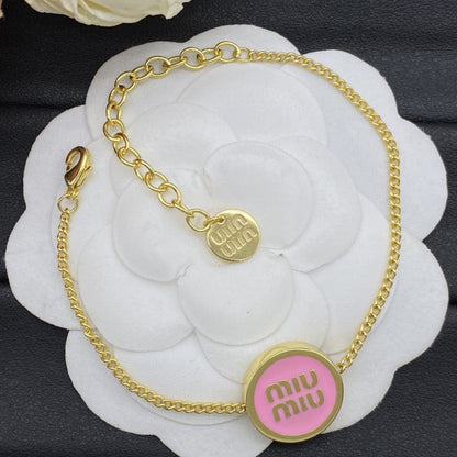 Miu Miu Gold-Plated Jewelry Set with Logo Tag

