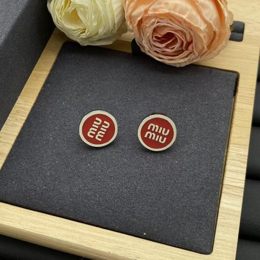 Round stud earrings with red enamel and silver-tone Miu Miu logo medallions