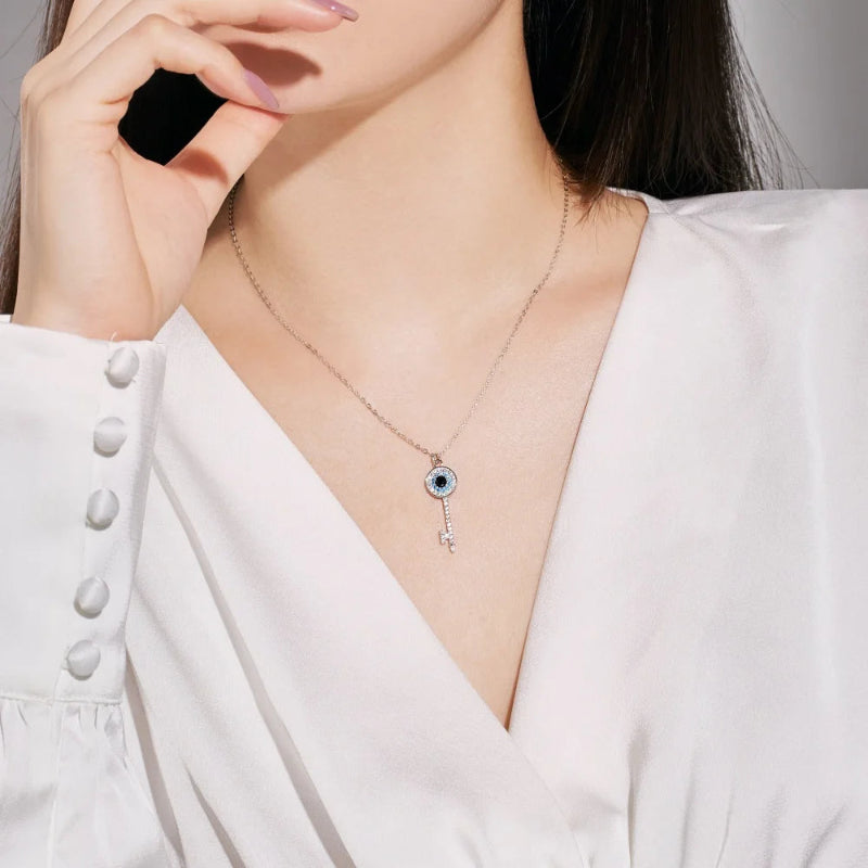 Dainty Silver Key Necklace with Blue and Black Eye

