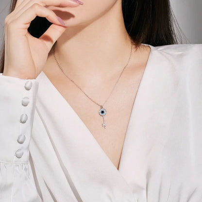Dainty Silver Key Necklace with Blue and Black Eye

