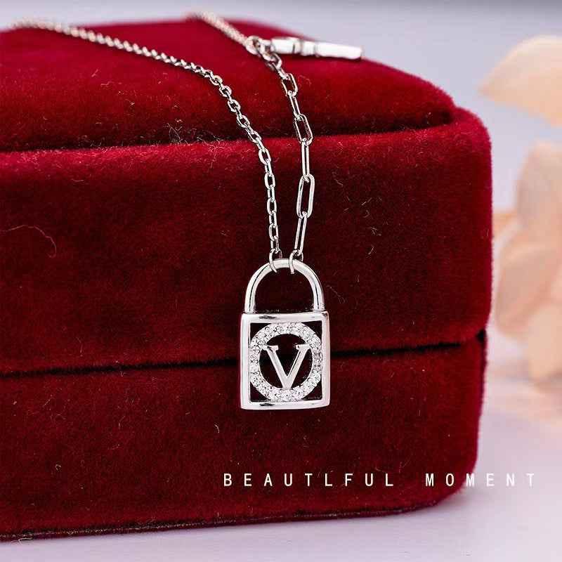 silver key and V lock necklace