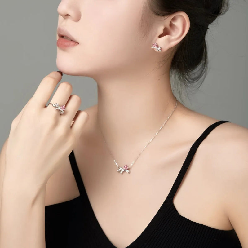 Chic Silver Ribbon Design with Pink Heart Gem

