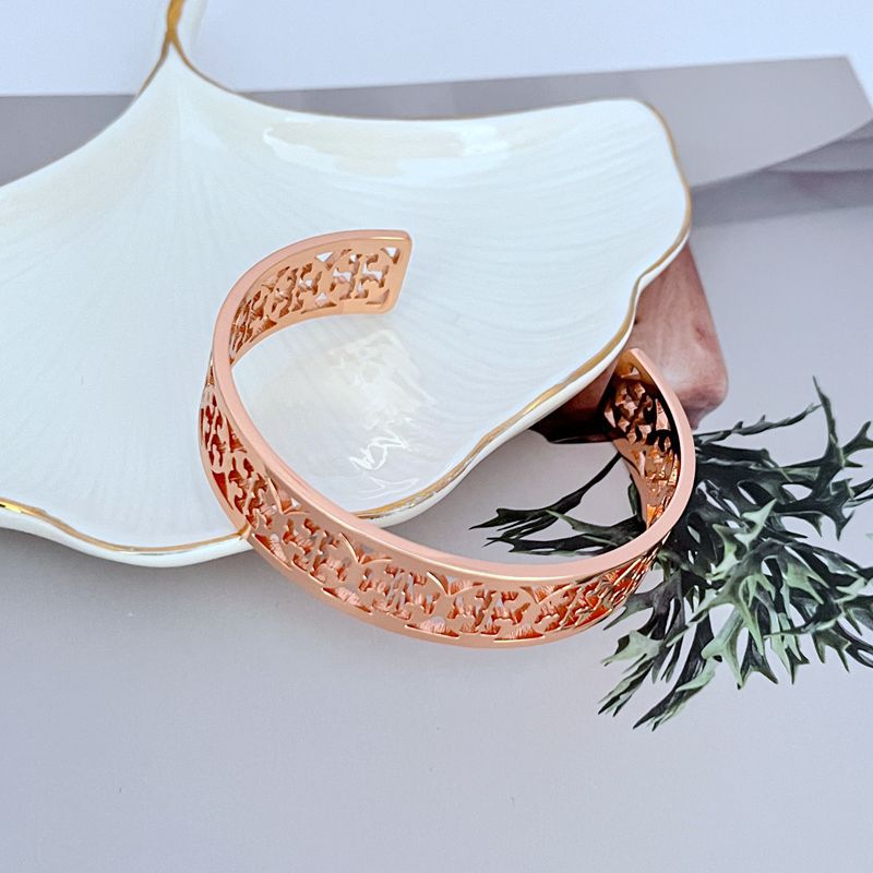 Tory Burch Fashionable Openwork Logo Metal Bangle