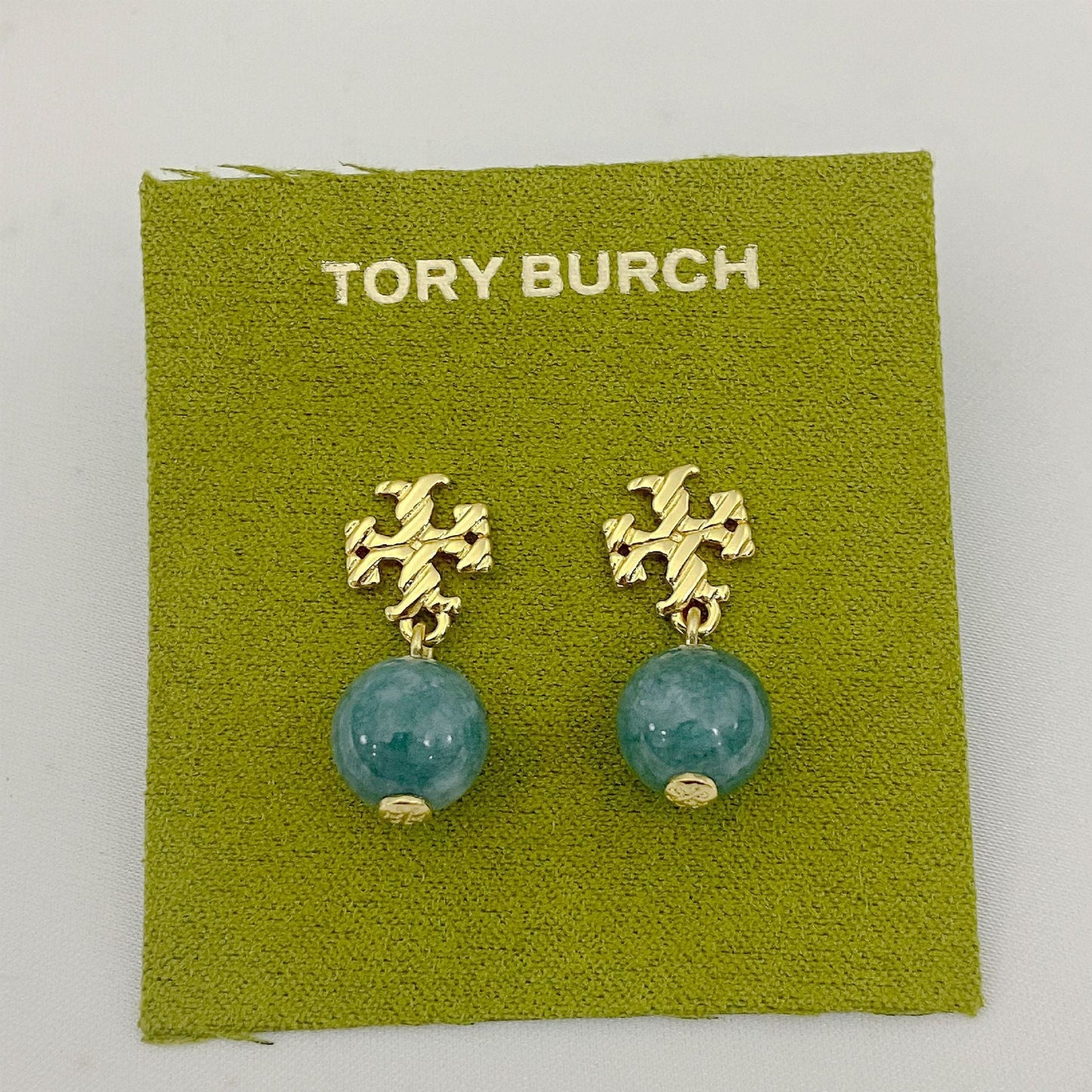 Gold-tone agate pendant earrings with round blue-green stones and leaf-like top