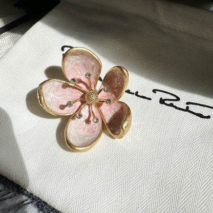 Pink enamel cherry blossom metal brooch with gold-tone petals and rhinestone details