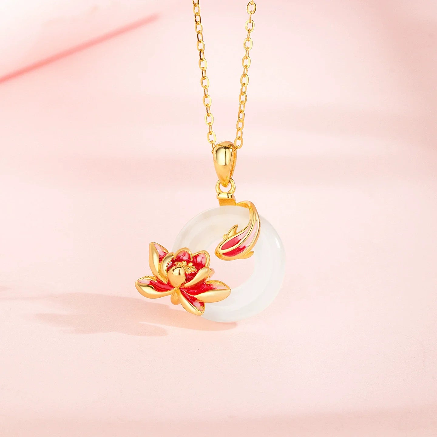 Natural white chalcedony peace-knot pendant with red enamel lotus flower, gold-tone