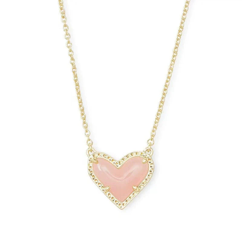 Heart pendant necklace with pink enamel heart and gold-tone chain