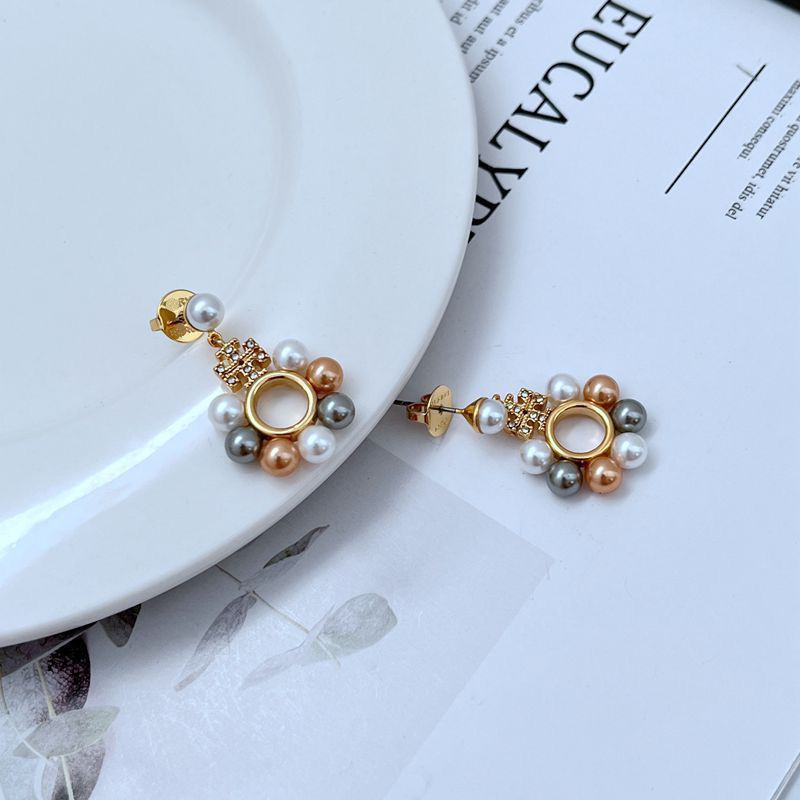 Tory Burch gold-tone pearl inlaid circle stud earrings with openwork rosette detail