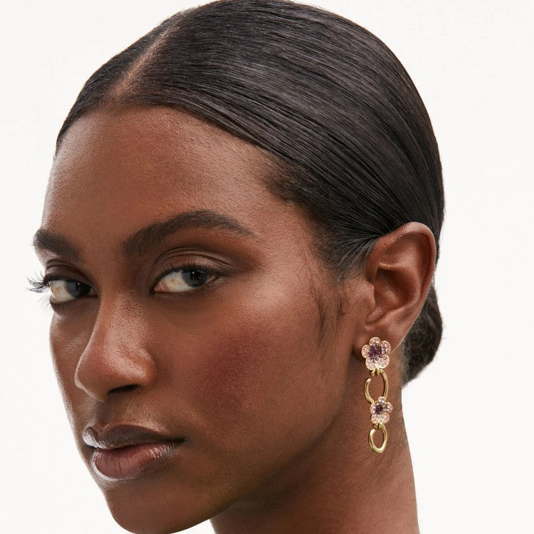 Floral dangle hoop earrings with gold-tone loops and purple crystal flower clusters