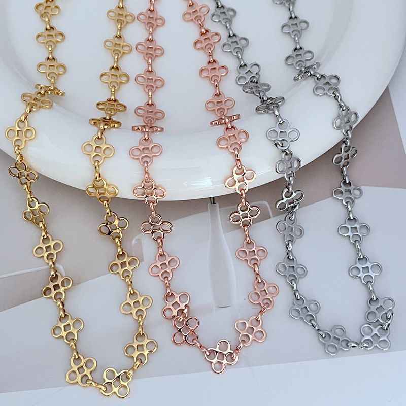 Four-leaf clover sweater chain necklace set in gold, rose gold, and silver-tone
