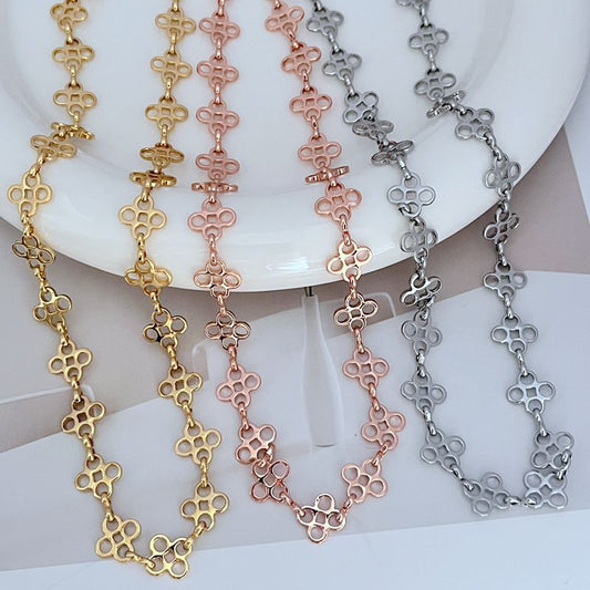 Four-leaf clover sweater chain necklace set in gold, rose gold, and silver-tone