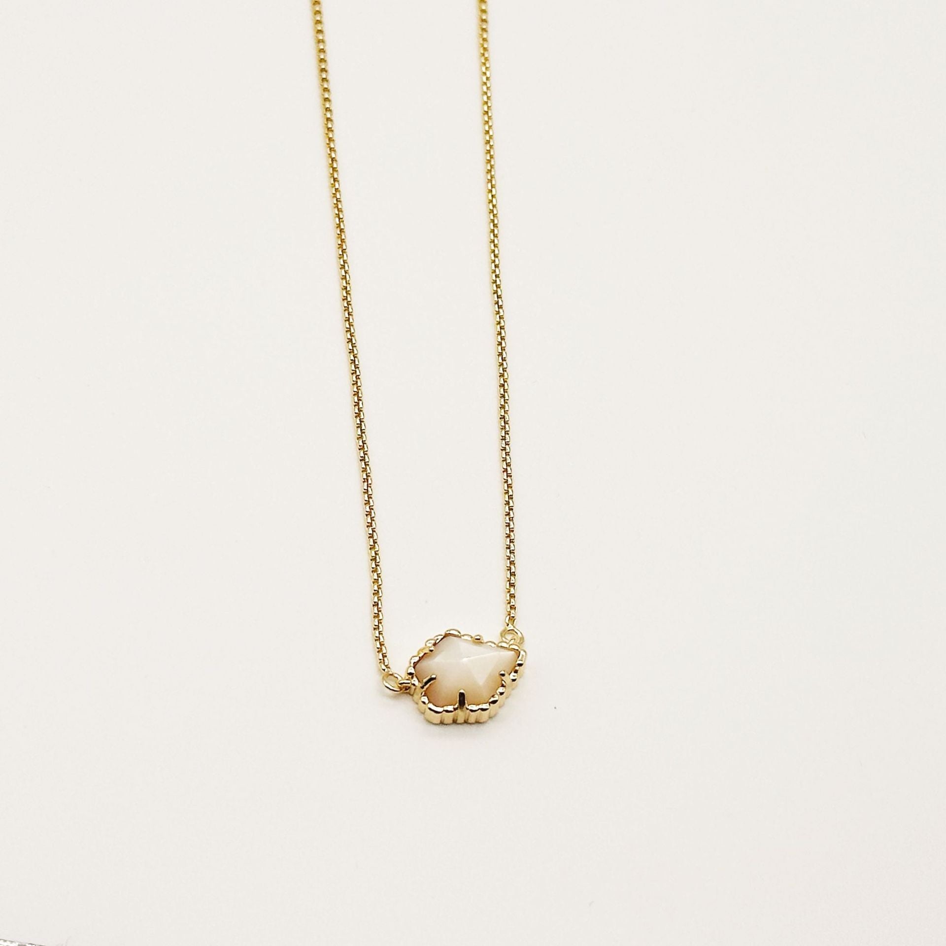 Kendra Scott gold-tone mother-of-pearl necklace with light iridescent rhombus pendant