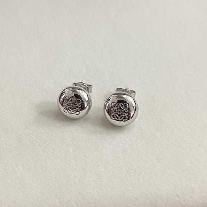 Silver round stud earrings with smooth bean shape and engraved knot design, stud backs