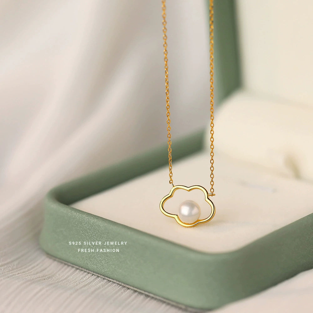 Gold-toned sterling silver necklace with cloud pendant and pearl, fine chain