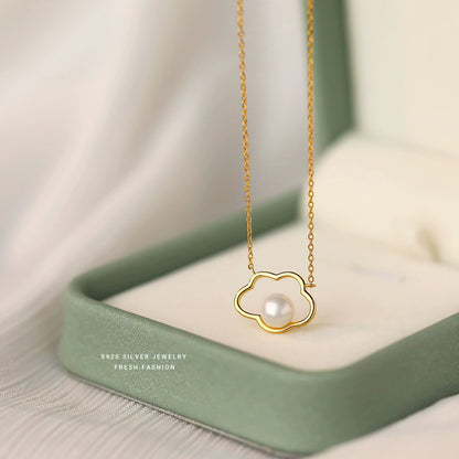 Gold-toned sterling silver necklace with cloud pendant and pearl, fine chain