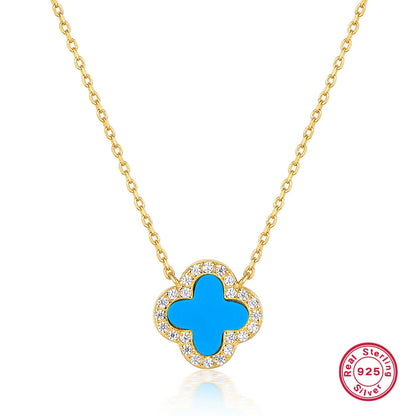 Blue clover centerpiece pendant with white rhinestones on gold-tone backing