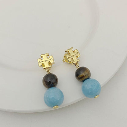 Tory Burch logo pendant earrings with round dark and light blue agate beads