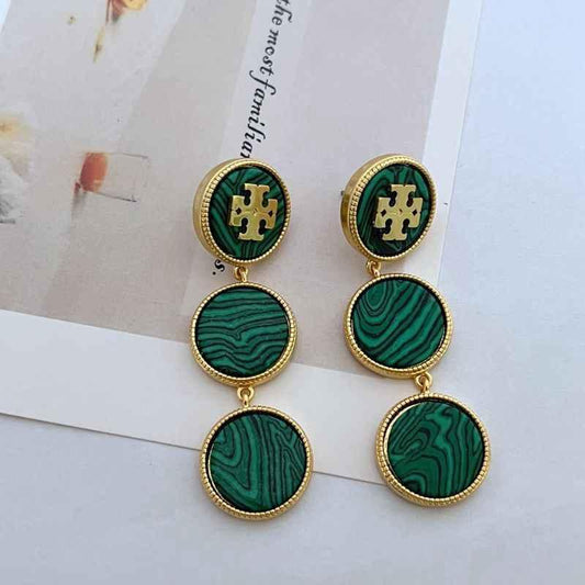 Green round shell dangle earrings with gold-tone logo medallions and linked drops