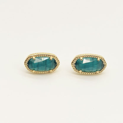 Kendra Scott oval gemstone stud earrings with teal crystal in gold bezel setting
