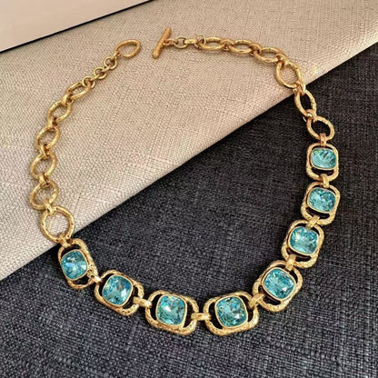 Gold-tone chain necklace with oval turquoise faceted crystals