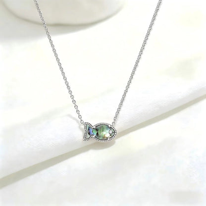 Fish-shaped iridescent pendant necklace, silver tone with small stones