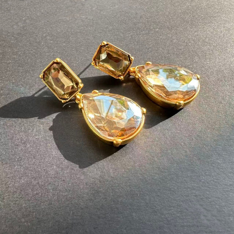 Teardrop-cut diamond stud earrings with champagne square studs and light amber teardrop stones