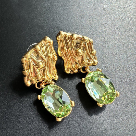 Gold-tone crystal drop earrings with oval green stones
