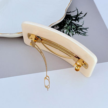 Tory Burch Haarklammer rechteckig Off-White mit goldfarbener Feder und Clips