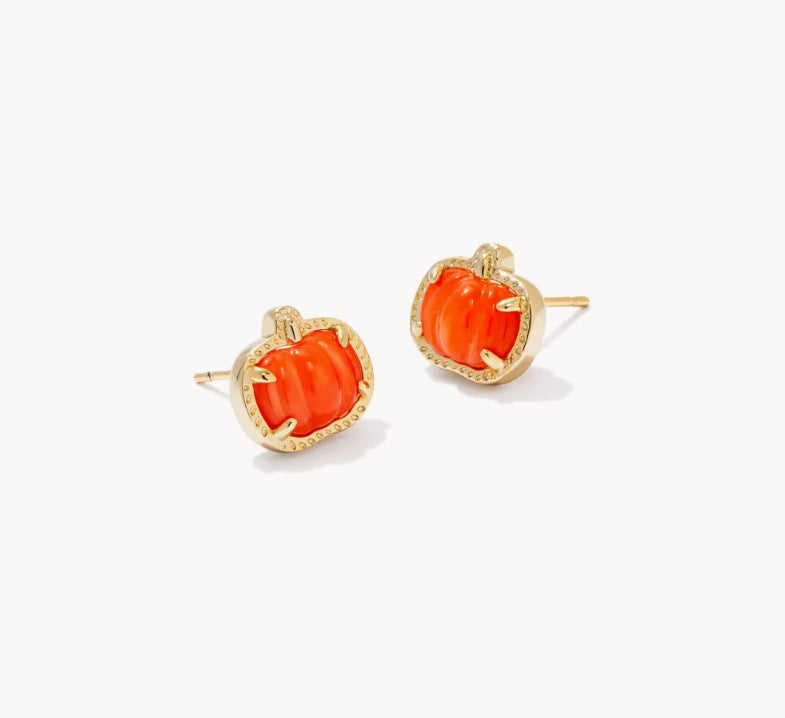 Gold-tone stud earrings with orange pumpkin faces and red-toned details