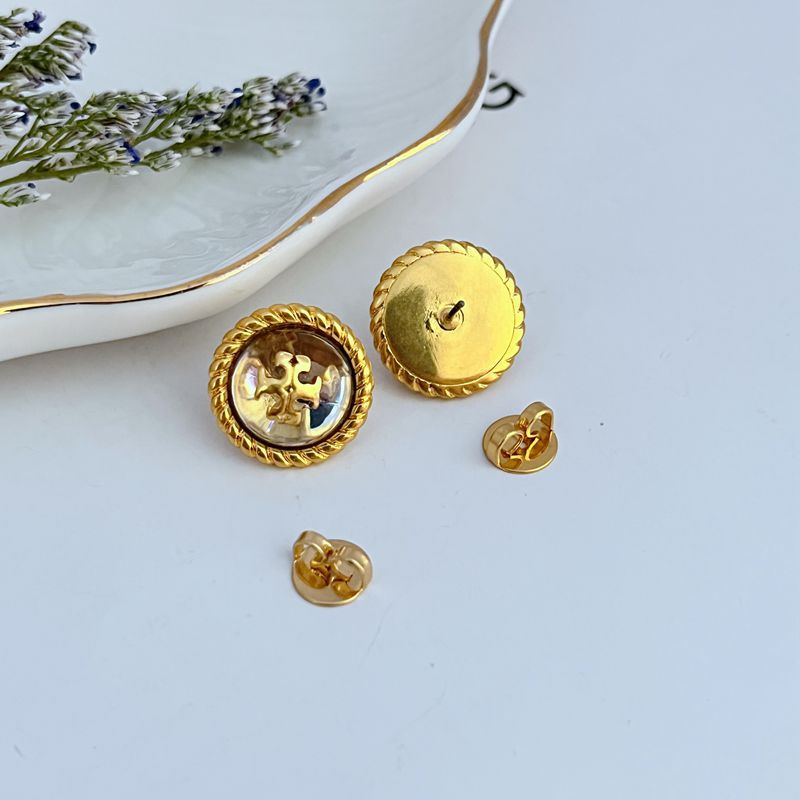 Gold-tone stud earrings shown from back with round posts and push backs