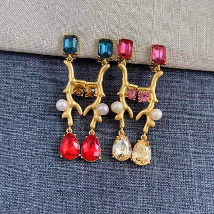 Gold-tone coral branch clip-on earrings with blue and pink stones, red teardrops, white pearls