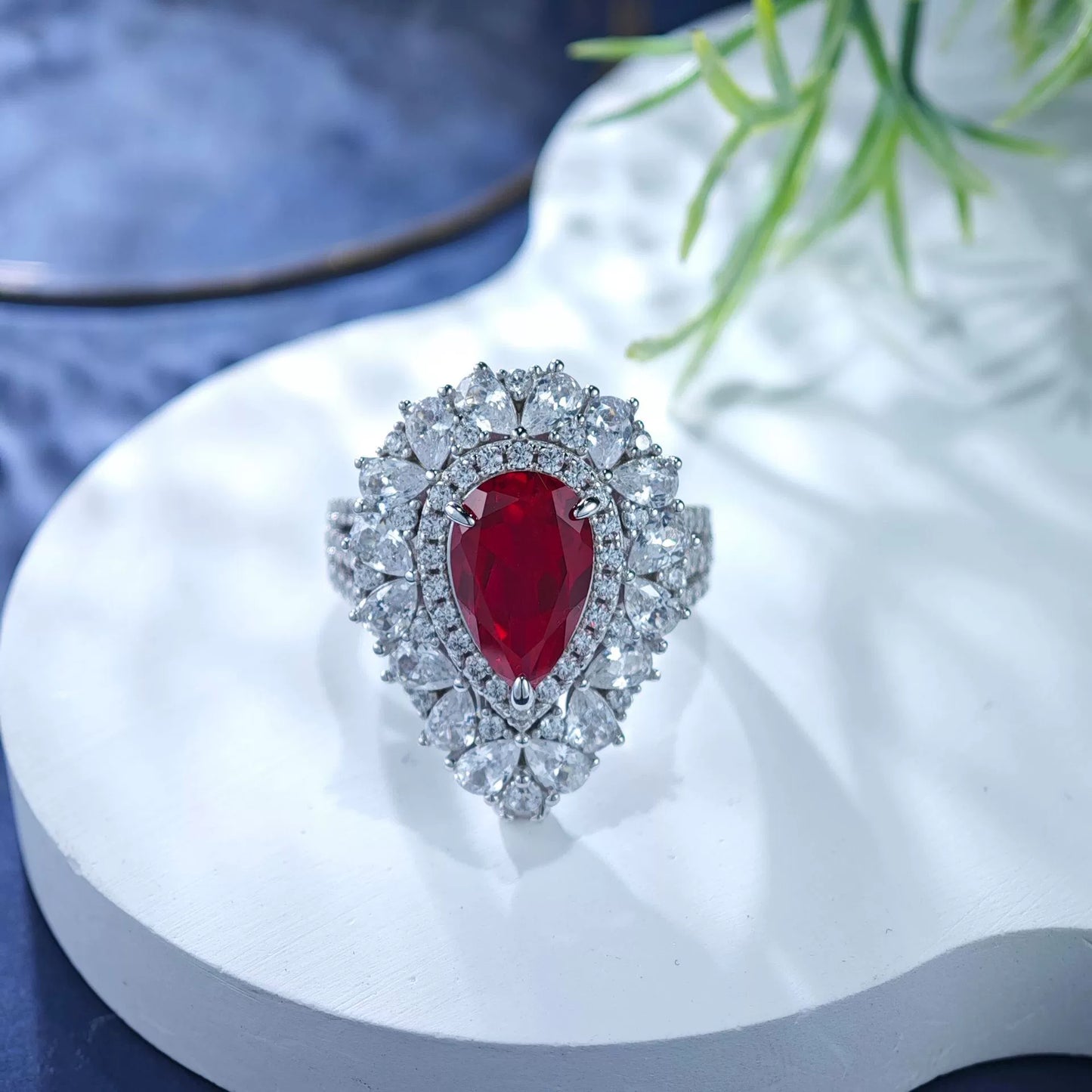Sterling silver ruby teardrop ring with diamond halo and scalloped cluster band