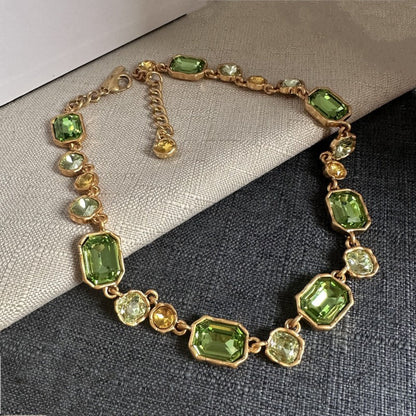 Square crystal pendant necklace with green faceted stones and gold-toned chain