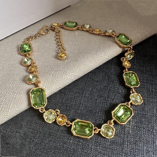 Square crystal pendant necklace with green faceted stones and gold-toned chain