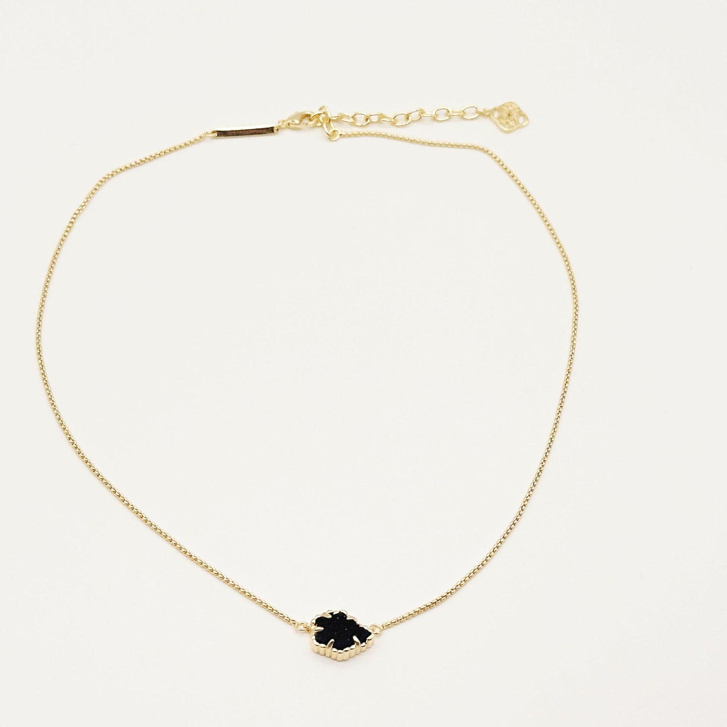 Kendra Scott gold-tone mother-of-pearl necklace with dark navy rhombus pendant