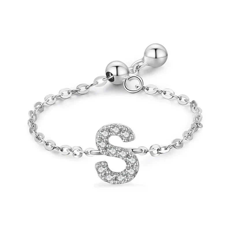 Pavé initial letter bracelet with an embossed “S” charm in sterling silver chain