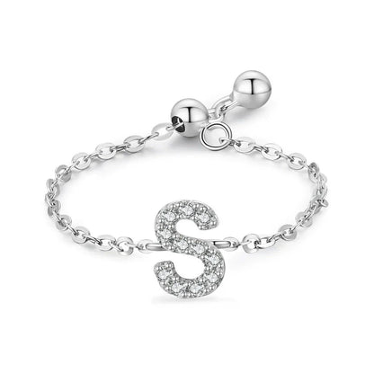 Pavé initial letter bracelet with an embossed “S” charm in sterling silver chain