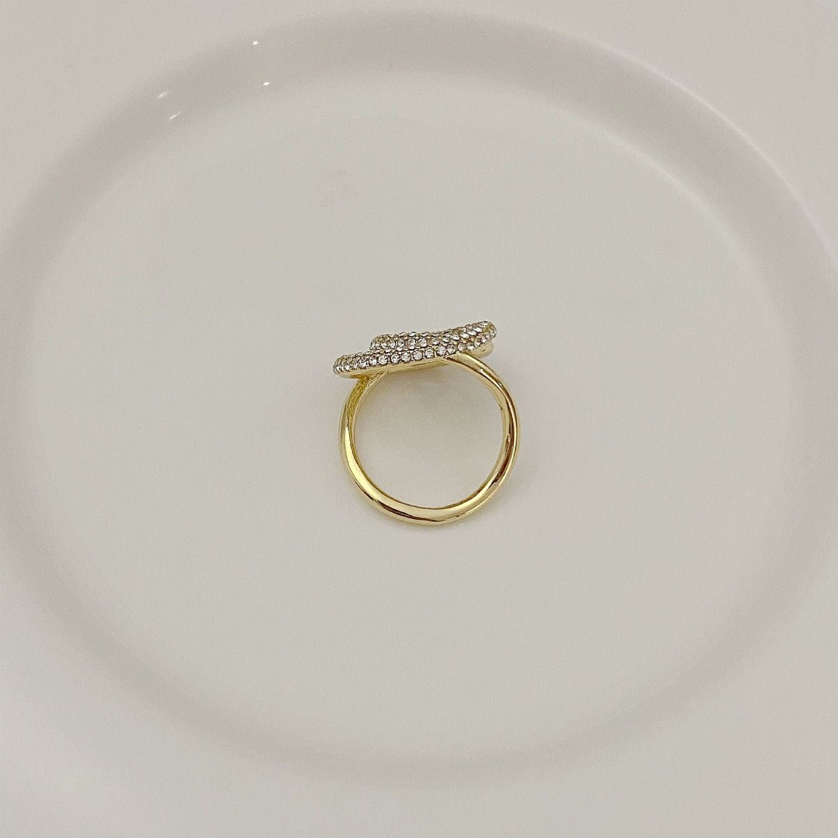 Gold-tone ring with pavé crystal double-loop design