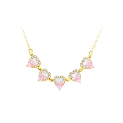 Gold-tone necklace with heart-shaped pink stones spaced along the chain
