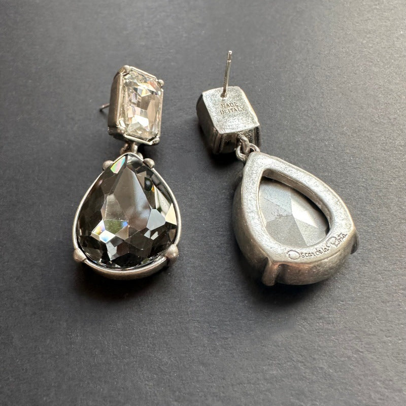 Silver-tone teardrop-cut stud earrings with clear and smoky gray stones