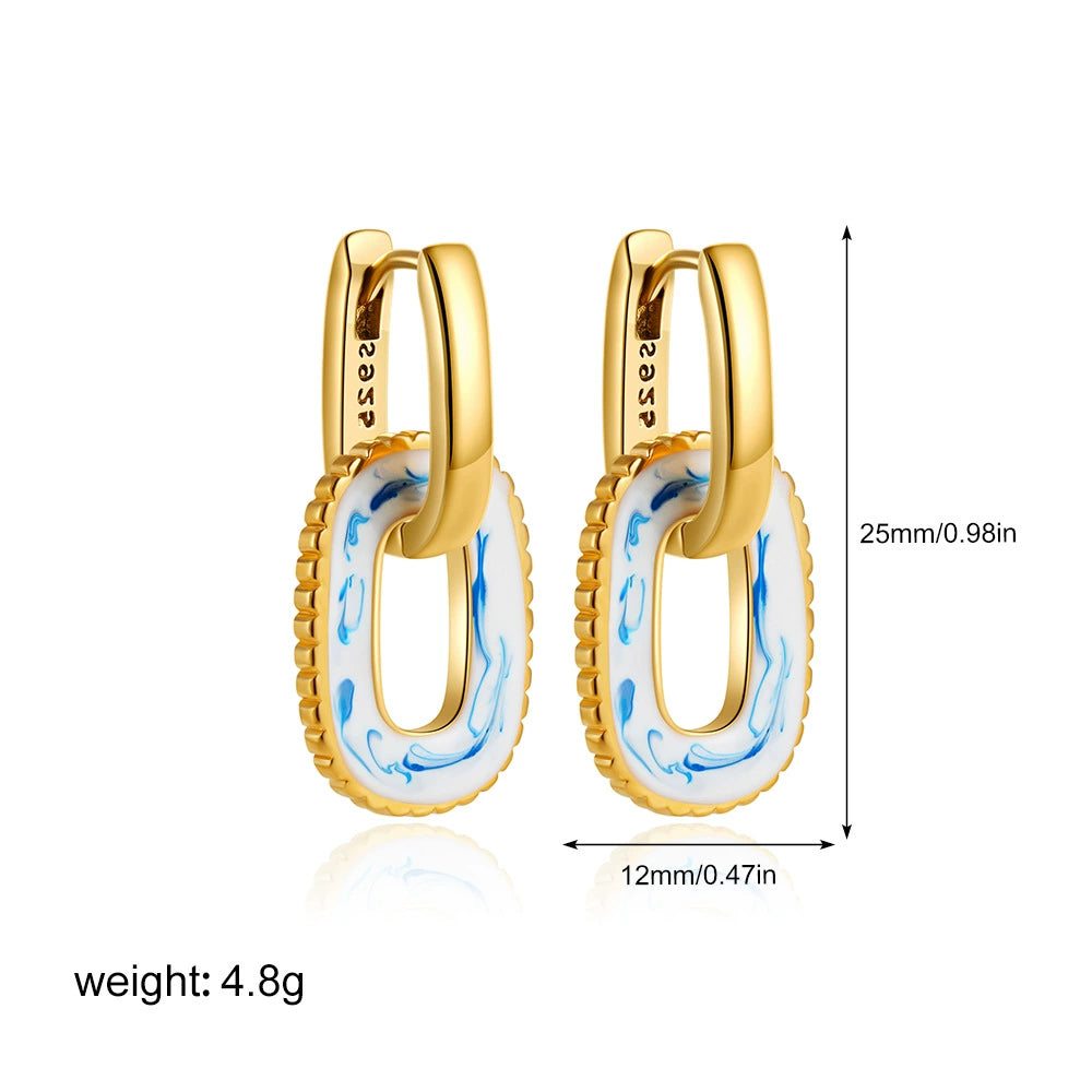 Gold-tone huggie hoop earrings with blue marbled oval inlay, 25mm