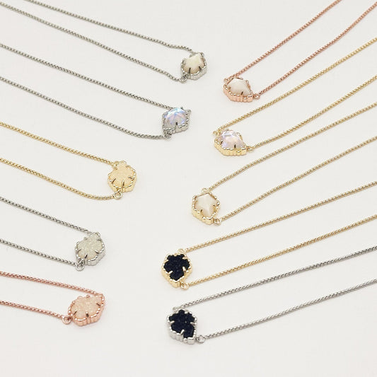 Set of Kendra Scott mother-of-pearl necklaces with rhombus pendants in mixed tones