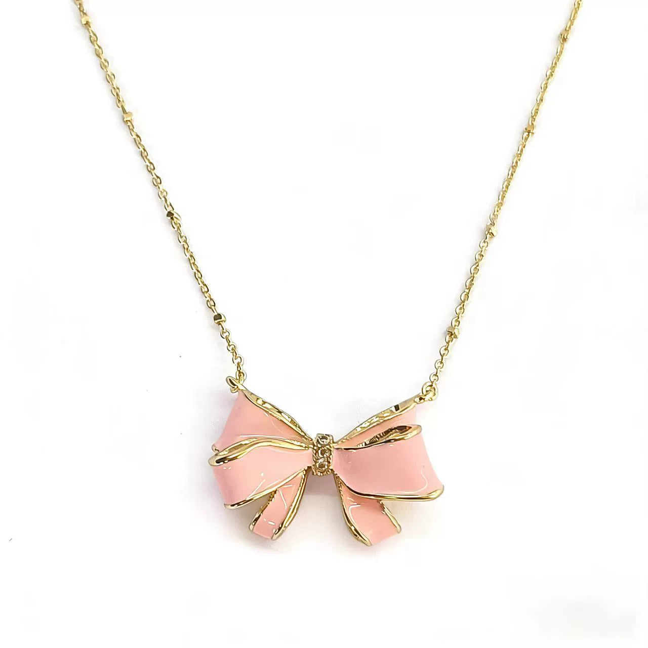Gold bow pendant necklace with pink enamel ribbon and pearl drop center