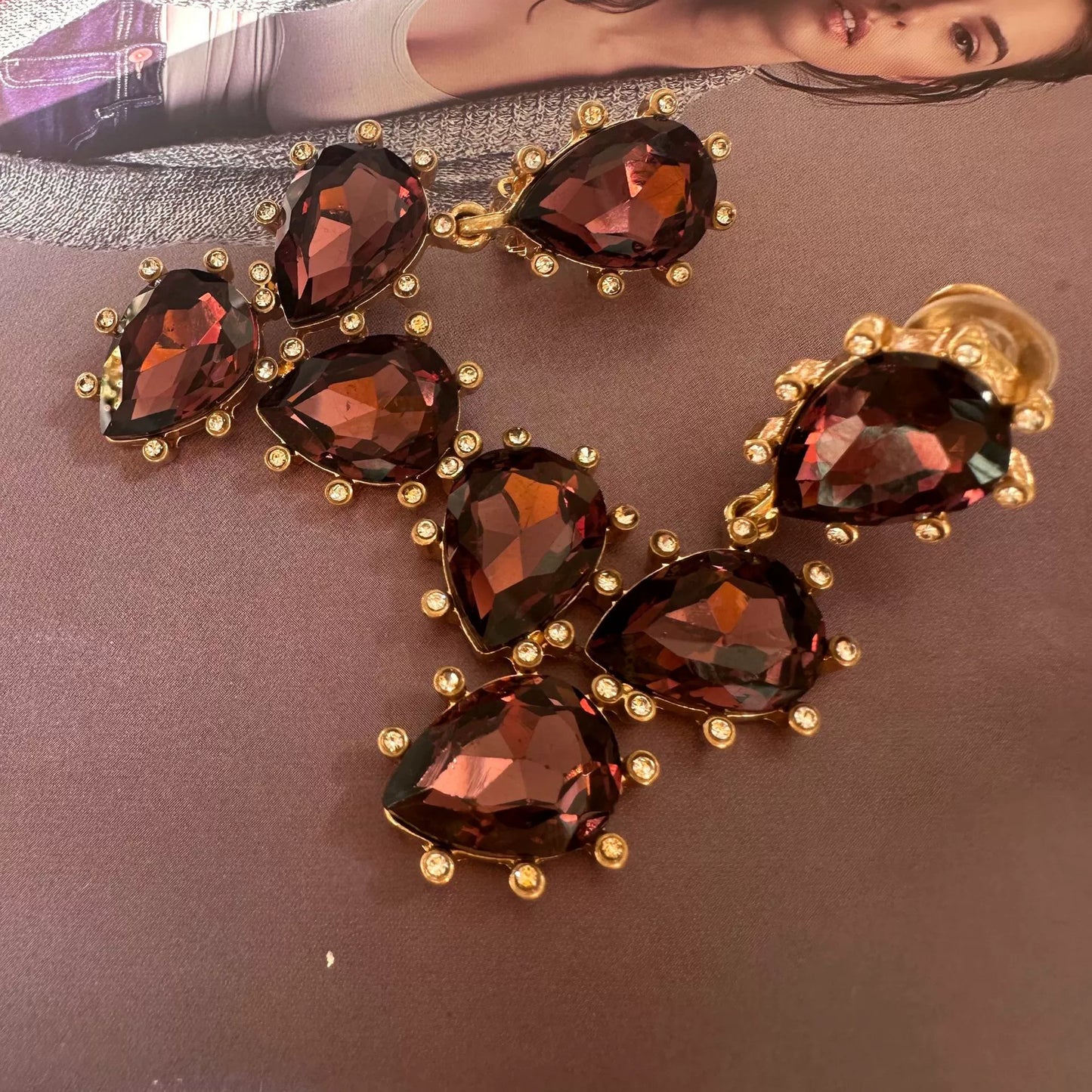Cactus-cut glass ear clips with dark red stones and gold-tone prong setting