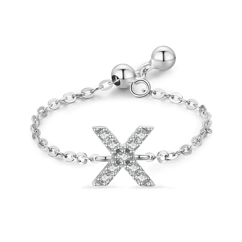 Pavé initial letter bracelet with an “X” charm in sterling silver link chain