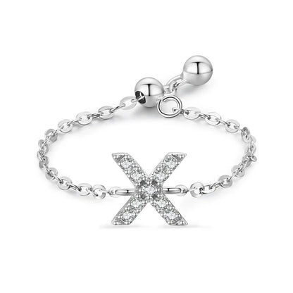 Pavé initial letter bracelet with an “X” charm in sterling silver link chain