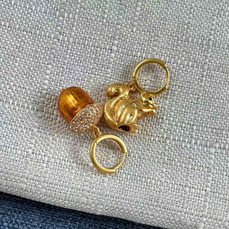 Gold squirrel and pine cone earrings